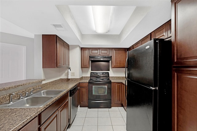 kitchen with light tile patterned floors, a raised ceiling, sink, and black appliances