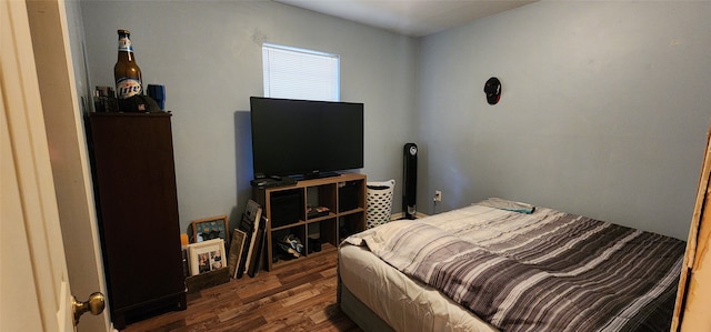 bedroom featuring dark hardwood / wood-style flooring