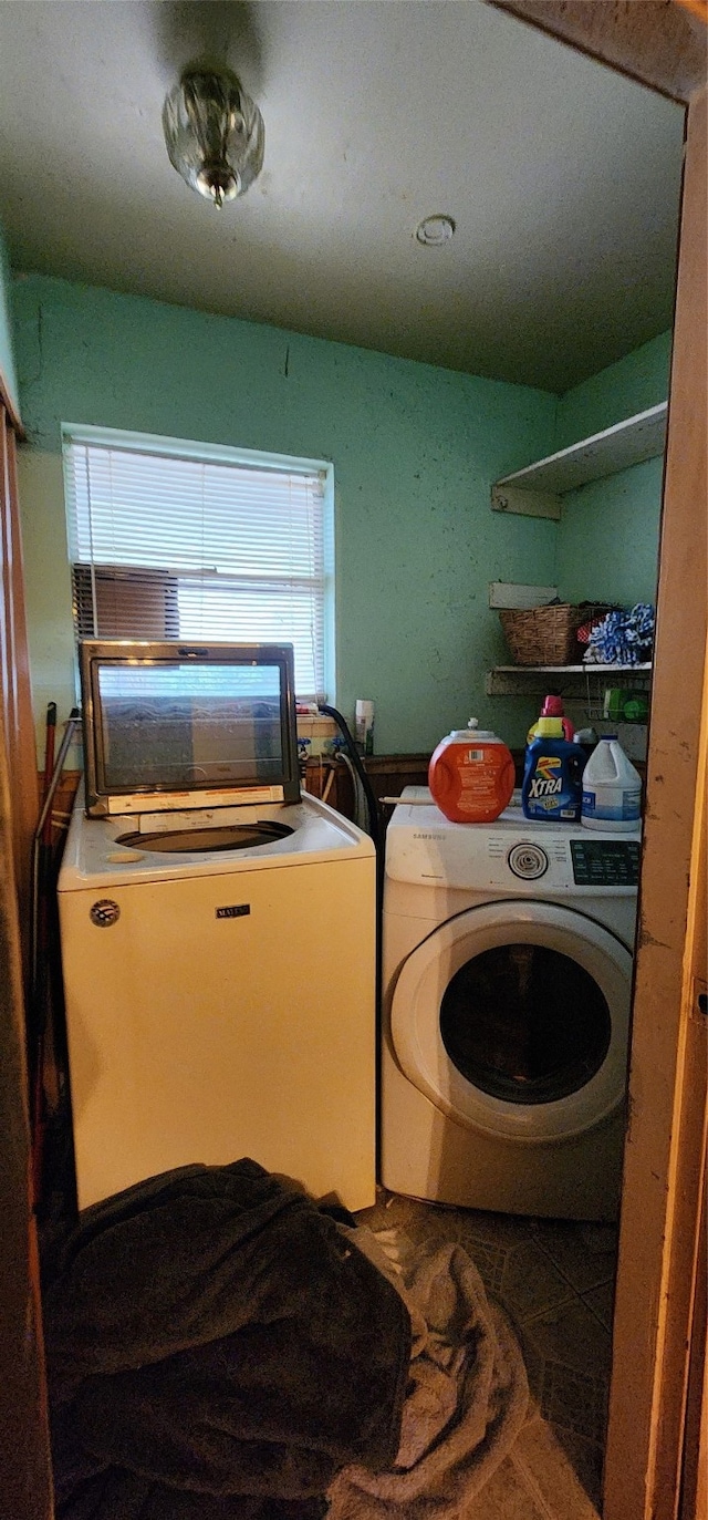 washroom with washer and dryer