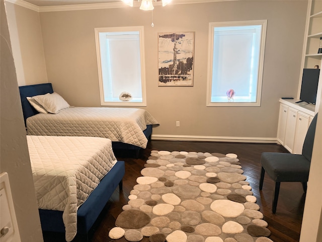 bedroom with crown molding and dark hardwood / wood-style flooring