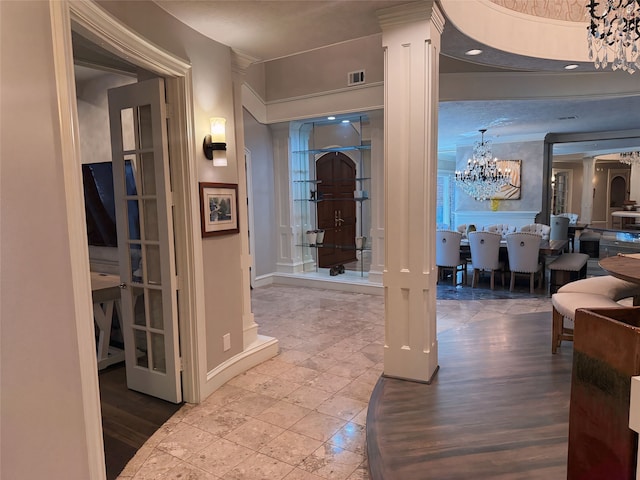 hall featuring a chandelier and hardwood / wood-style flooring