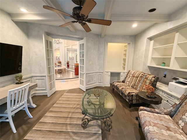 living room featuring hardwood / wood-style flooring, built in shelves, beam ceiling, ceiling fan, and french doors