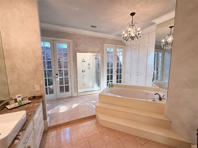 bathroom with vanity, french doors, plus walk in shower, tile patterned floors, and crown molding