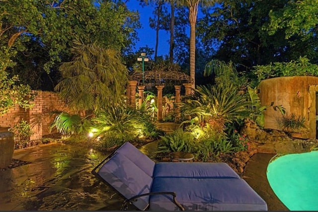 patio at twilight with a swimming pool