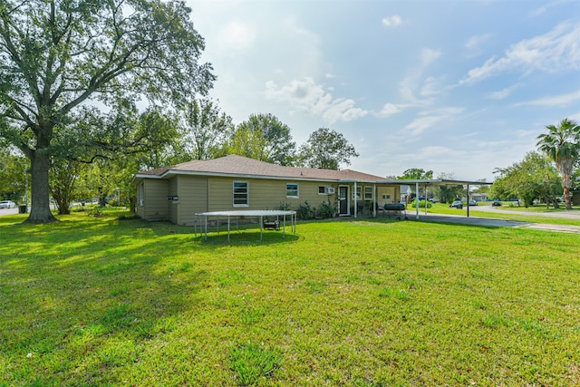 rear view of house with a lawn