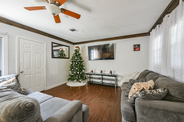 living room with ceiling fan, dark hardwood / wood-style floors, a textured ceiling, and crown molding