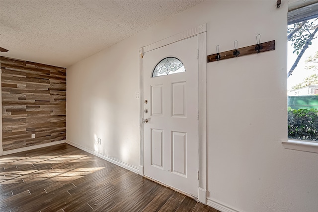 entrance foyer with a textured ceiling and hardwood / wood-style flooring