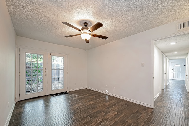 unfurnished room featuring ceiling fan, a textured ceiling, and dark hardwood / wood-style flooring