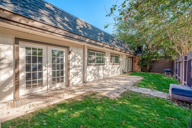 view of yard with a patio and french doors