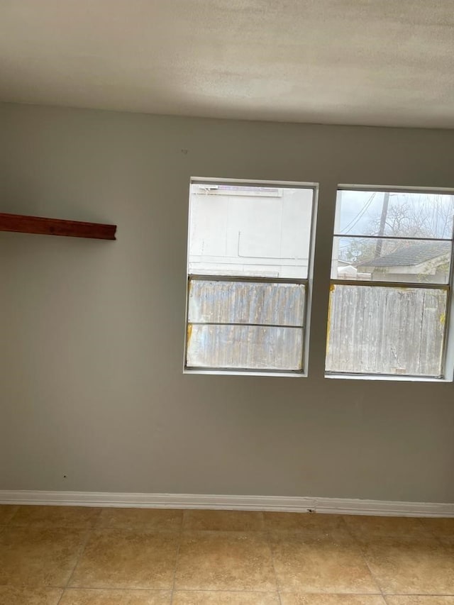 view of tiled spare room