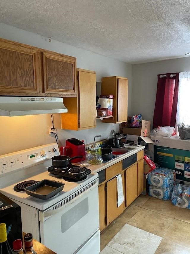 kitchen featuring a textured ceiling, white electric range oven, and extractor fan