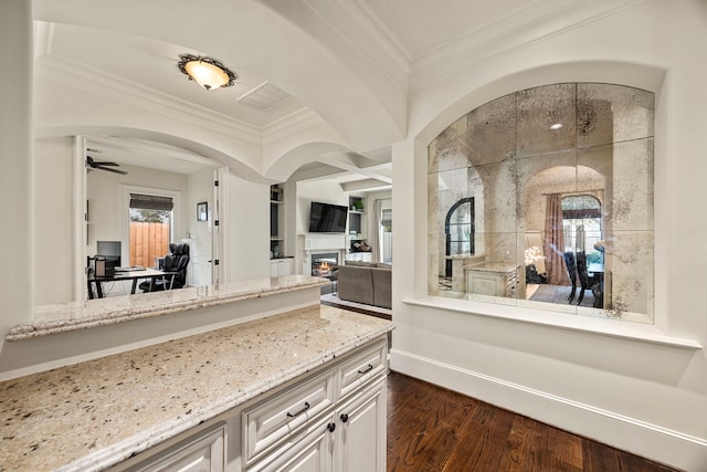 bathroom with hardwood / wood-style flooring, a shower, crown molding, ceiling fan, and vanity