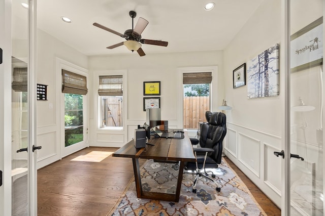 office space featuring french doors, dark hardwood / wood-style floors, and ceiling fan