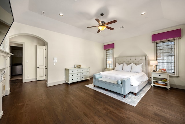 bedroom featuring ceiling fan and dark wood-type flooring