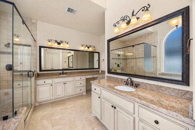 bathroom with walk in shower and vanity