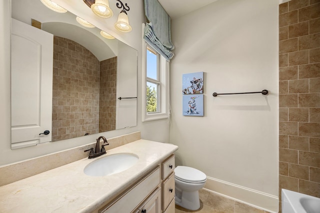 bathroom with vanity, tile patterned flooring, and toilet