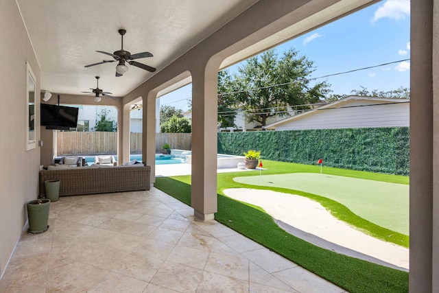 view of patio with ceiling fan, a fenced in pool, and an outdoor hangout area