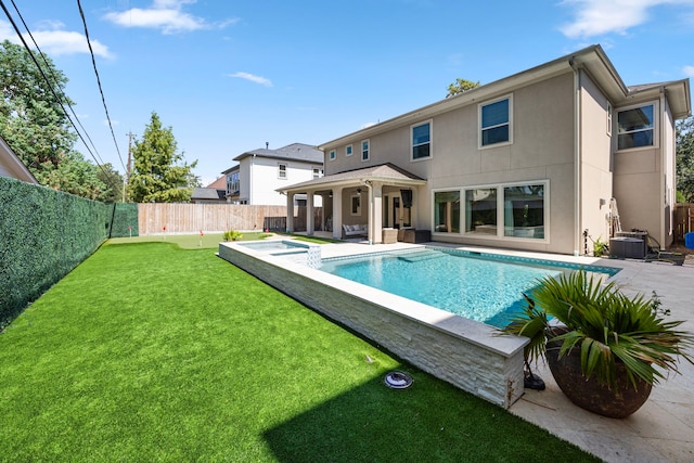 view of pool featuring a lawn, cooling unit, and a patio area