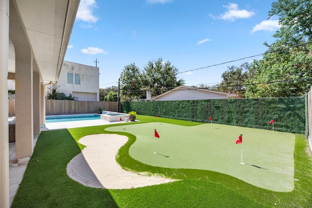 view of property's community with a swimming pool and a patio area