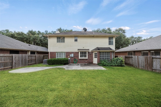 rear view of house featuring central AC unit, a lawn, and a patio area