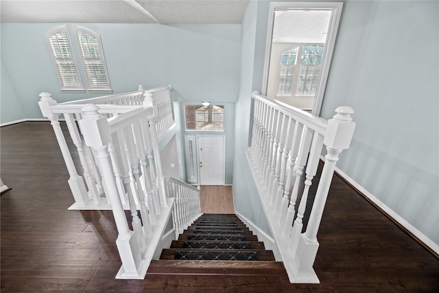 stairs with hardwood / wood-style floors