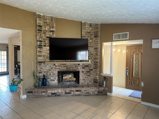 unfurnished living room featuring a fireplace, a textured ceiling, vaulted ceiling, and light tile patterned floors