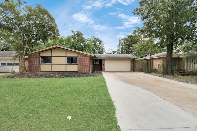 ranch-style home with a front yard and a garage