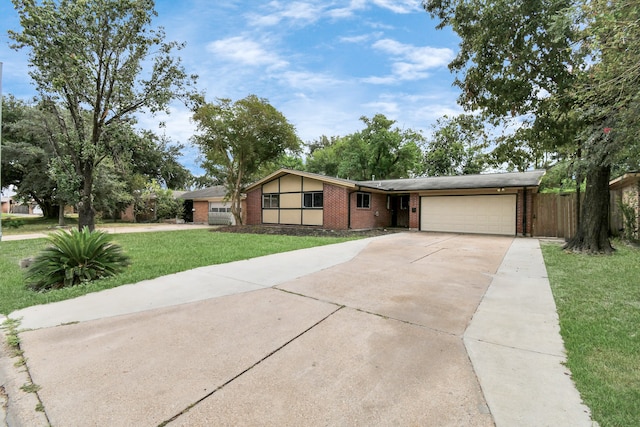 ranch-style house with a front yard and a garage