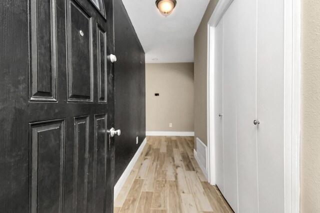 hallway featuring light hardwood / wood-style flooring