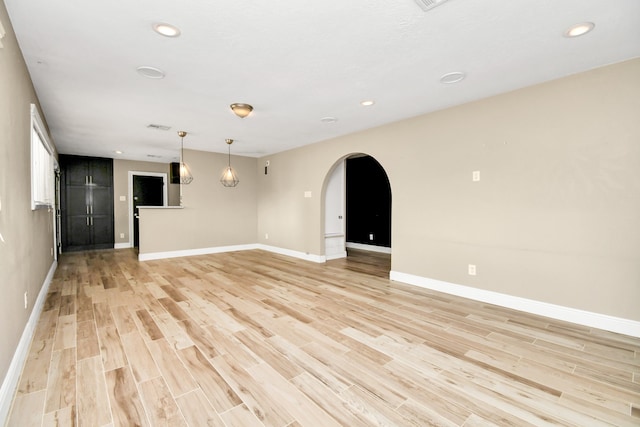 spare room featuring light wood-type flooring