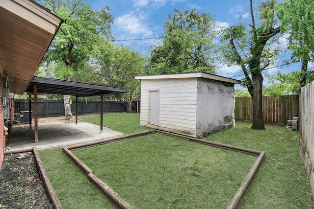 view of yard featuring cooling unit, a shed, and a patio area