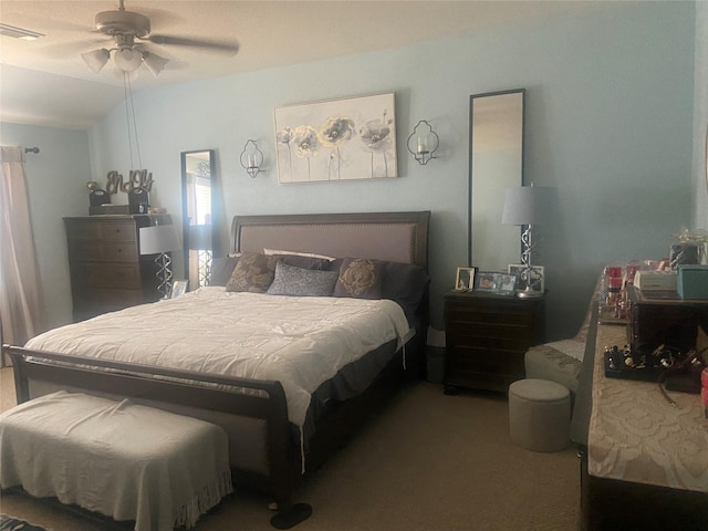 bedroom with carpet flooring, ceiling fan, and vaulted ceiling