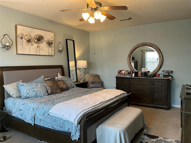 bedroom featuring light carpet and ceiling fan