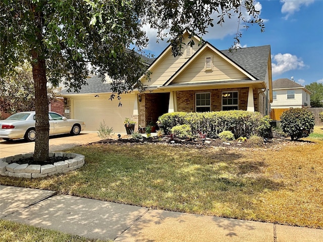 view of front of house with a front yard and a garage