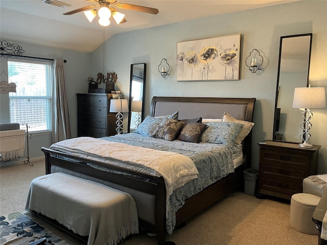 carpeted bedroom featuring ceiling fan, lofted ceiling, and multiple windows