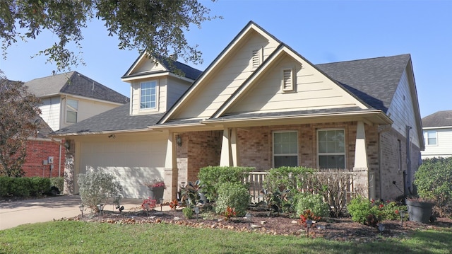 view of front facade featuring covered porch and a garage