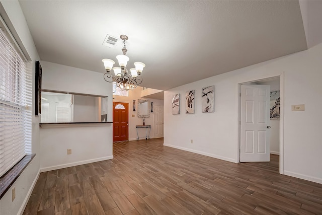 5110 Prairie Creek Dr, Houston, TX 77084 - unfurnished living room with wood finished floors, a chandelier, and baseboards