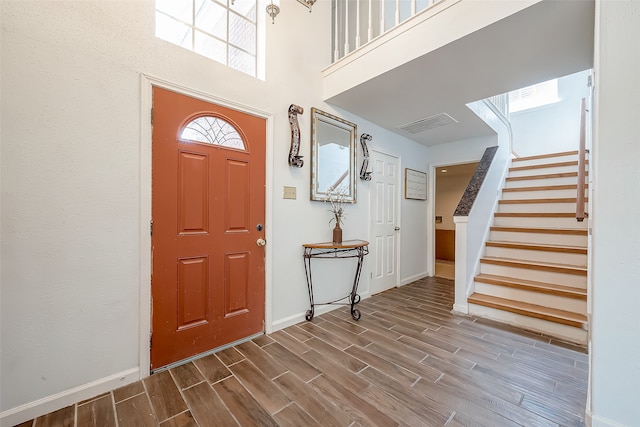 entrance foyer featuring hardwood / wood-style flooring