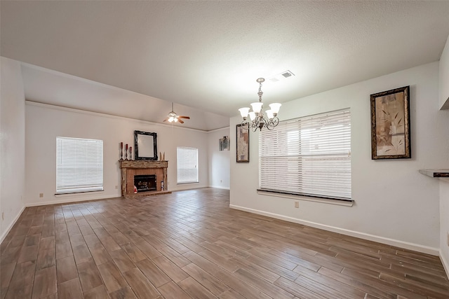 5110 Prairie Creek Dr, Houston, TX 77084 - unfurnished living room featuring a chandelier, wood finished floors, ceiling fan, baseboards, and lofted ceiling