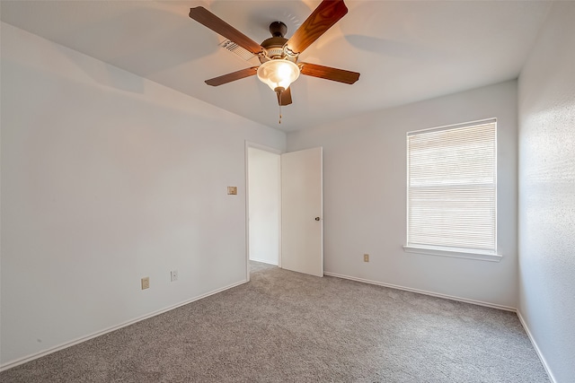 unfurnished room with carpet flooring and ceiling fan