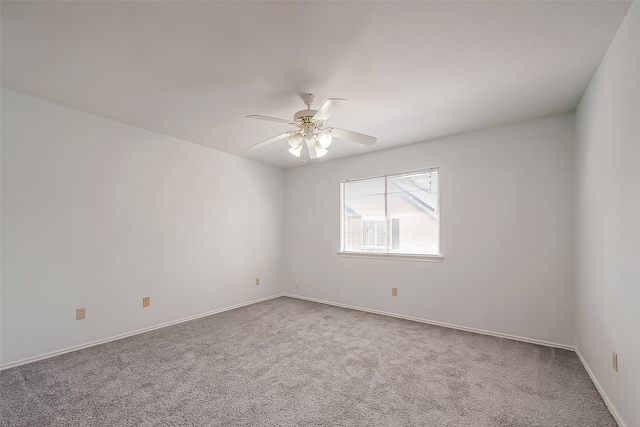 unfurnished room featuring carpet and ceiling fan