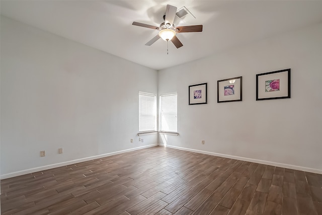 unfurnished room featuring dark hardwood / wood-style floors and ceiling fan