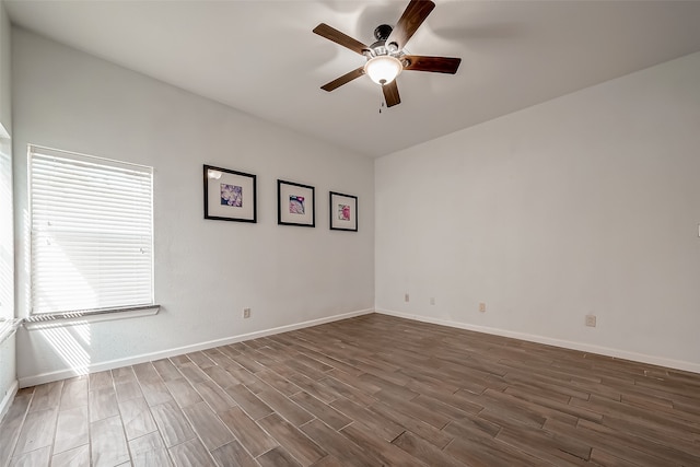 spare room with ceiling fan and dark hardwood / wood-style floors