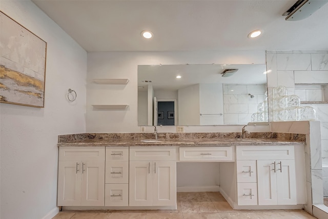 5110 Prairie Creek Dr, Houston, TX 77084 - bathroom with a walk in shower, double vanity, baseboards, tile patterned floors, and recessed lighting