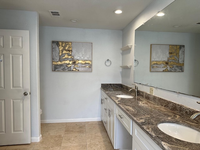 5110 Prairie Creek Dr, Houston, TX 77084 - bathroom with double vanity, baseboards, tile patterned flooring, and recessed lighting