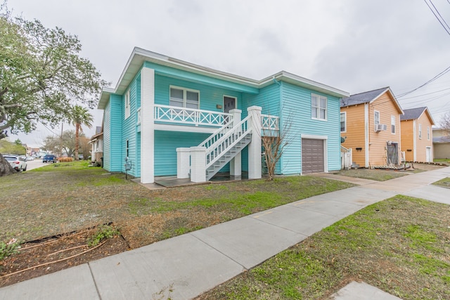 view of front of property with a garage and a front yard