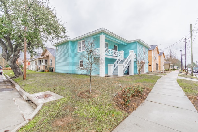 view of front of property with a front lawn