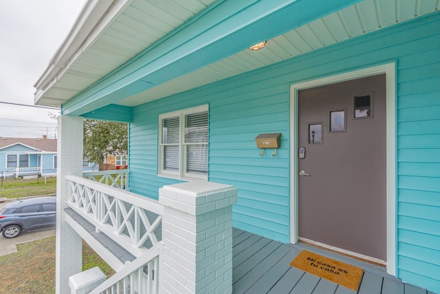 doorway to property featuring a porch