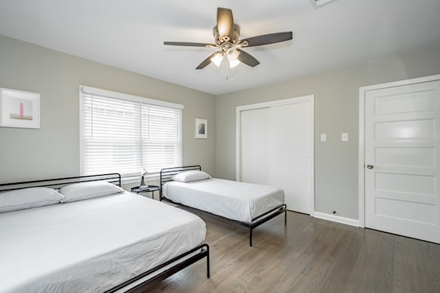 bedroom featuring ceiling fan and dark hardwood / wood-style flooring