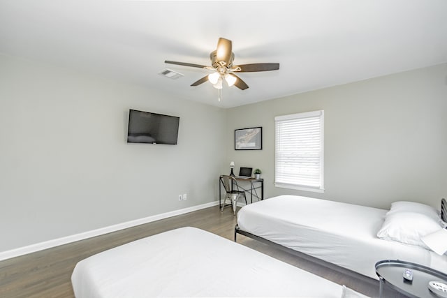 bedroom featuring dark wood-type flooring and ceiling fan